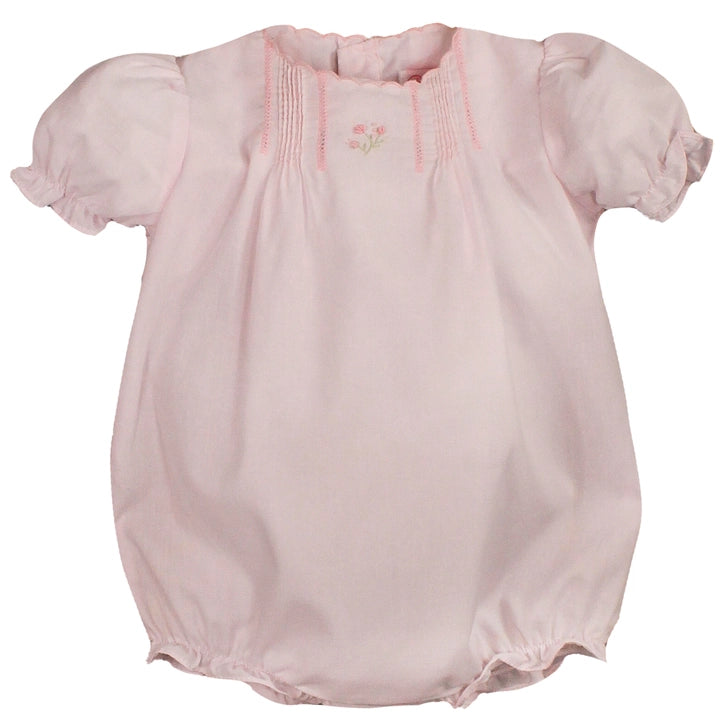 White heirloom baby girl bubble outfit with floral embroidery, scalloped trim, and delicate pintuck details
