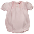 White heirloom baby girl bubble outfit with floral embroidery, scalloped trim, and delicate pintuck details