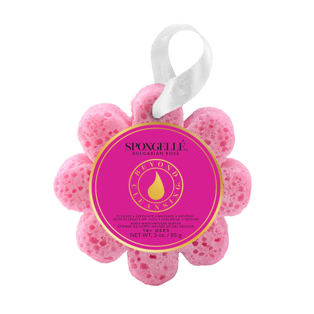 Pink flower-shaped sponge with a label on a white background