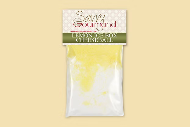 Savvy Gourmand lemon ice box cheeseball packaging on a beige background