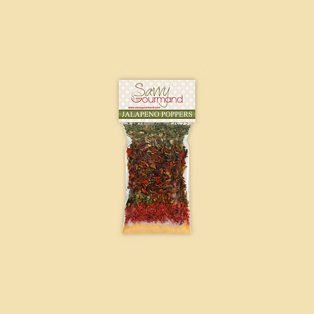 Packaged jalapeno poppers with Savvy Gourmand label on a beige background