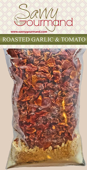 Packaged roasted garlic and tomato mix from Savvy Gourmand on a beige background