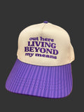 Out Here Living Beyond My Means Hat Purple