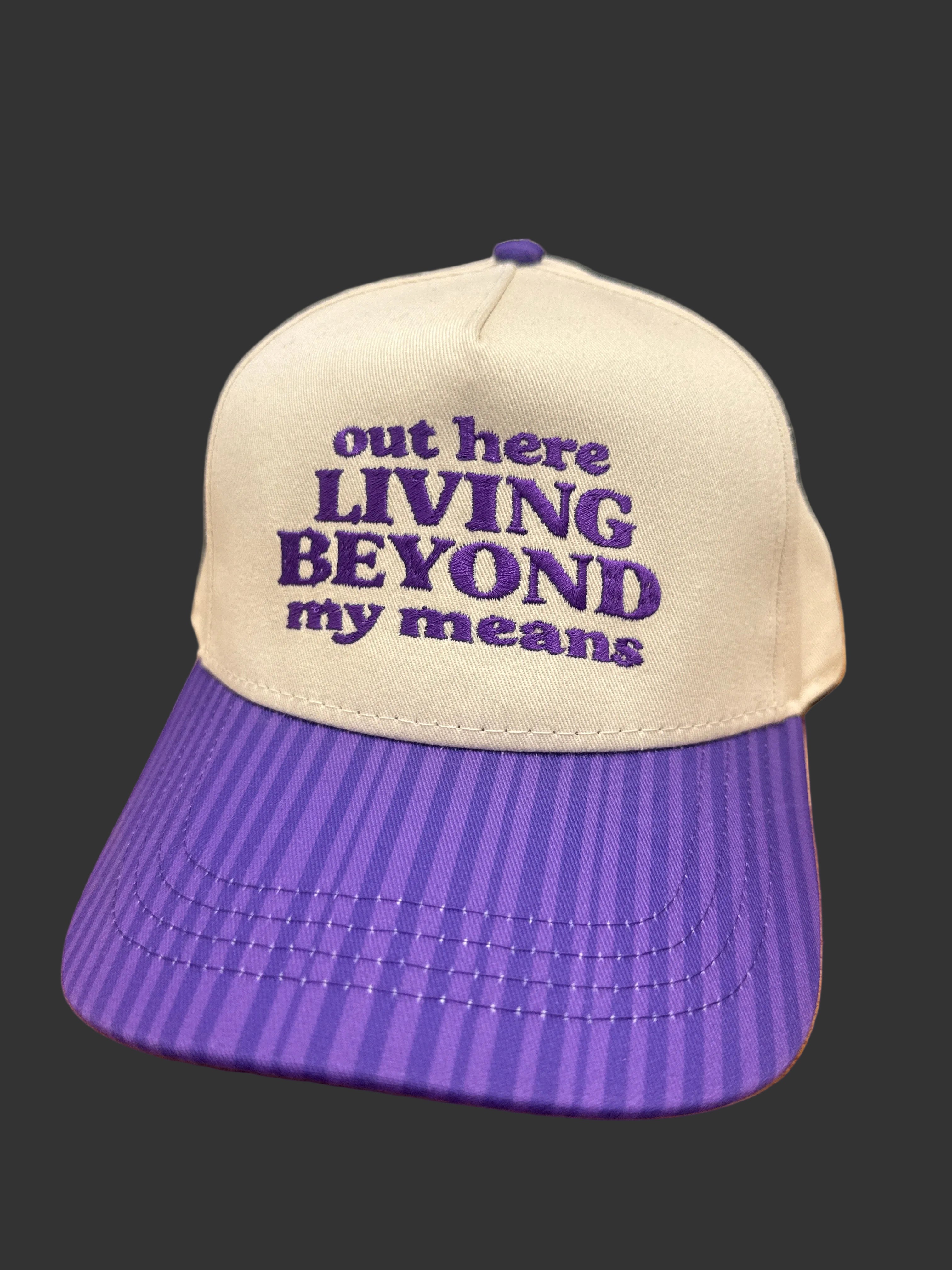 Out Here Living Beyond My Means Hat Purple