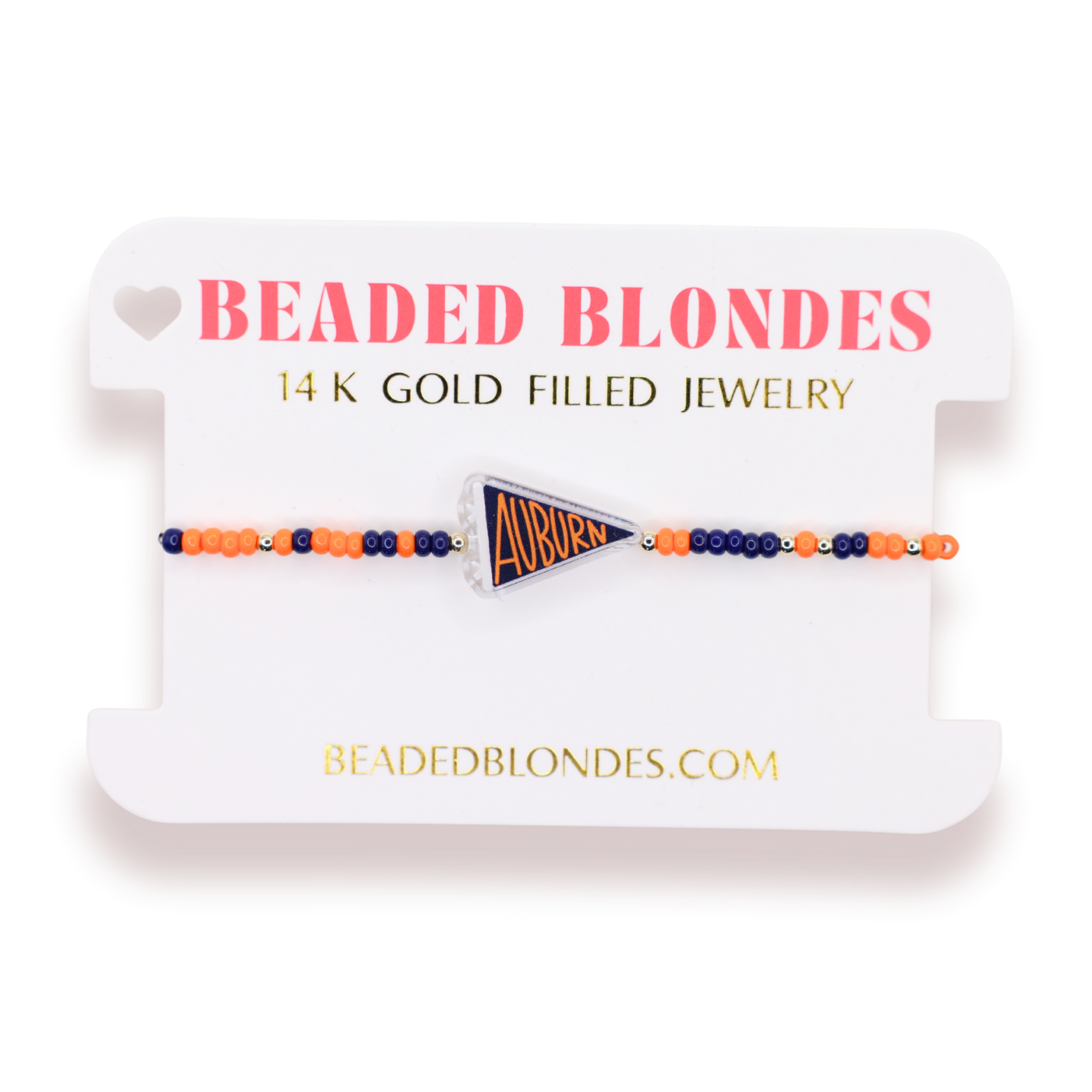 A beaded bracelet with orange, navy blue, and gold beads, featuring a central triangular 'Auburn' pennant charm, displayed on a white branded card labeled 'BEADED BLONDES'.