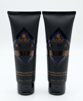 Two black tubes of Jack Black Black Reserve body lotion on a white background
