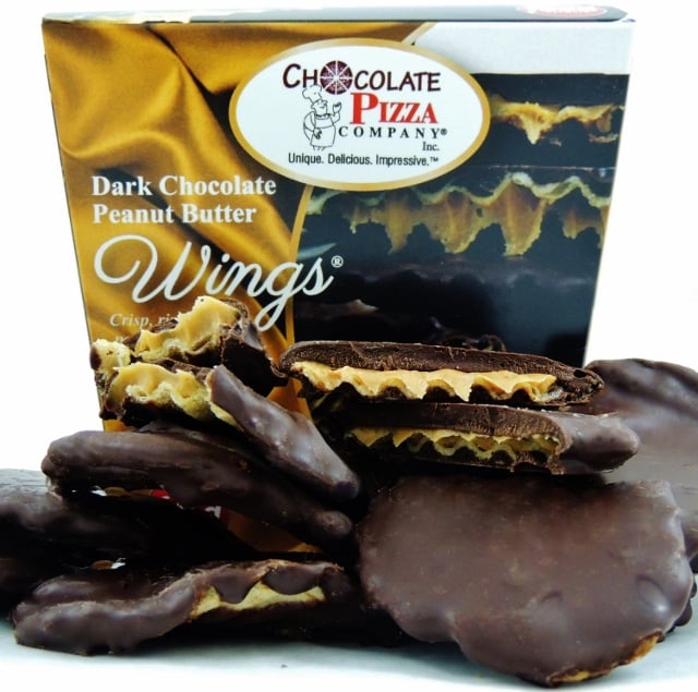 Dark chocolate peanut butter wings with a box from Chocolate Pizza Company on a white background