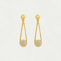 Gold earrings with teardrop design and embedded stones on a light gray background