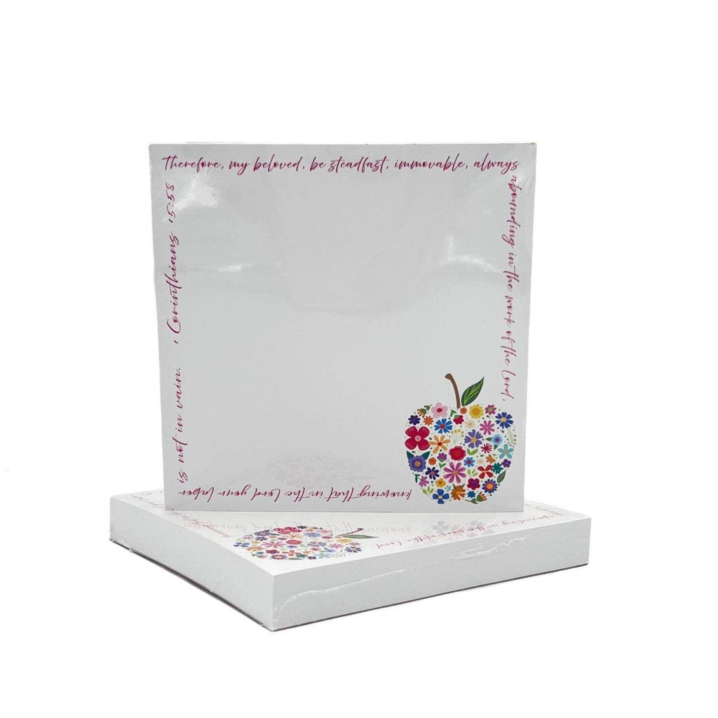 Decorative notepad with floral apple design and text on a white background
