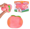 Squeeze toy shaped like a peach with packaging in the background