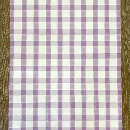 Checkered table runner  purple and white pattern on a wooden surface