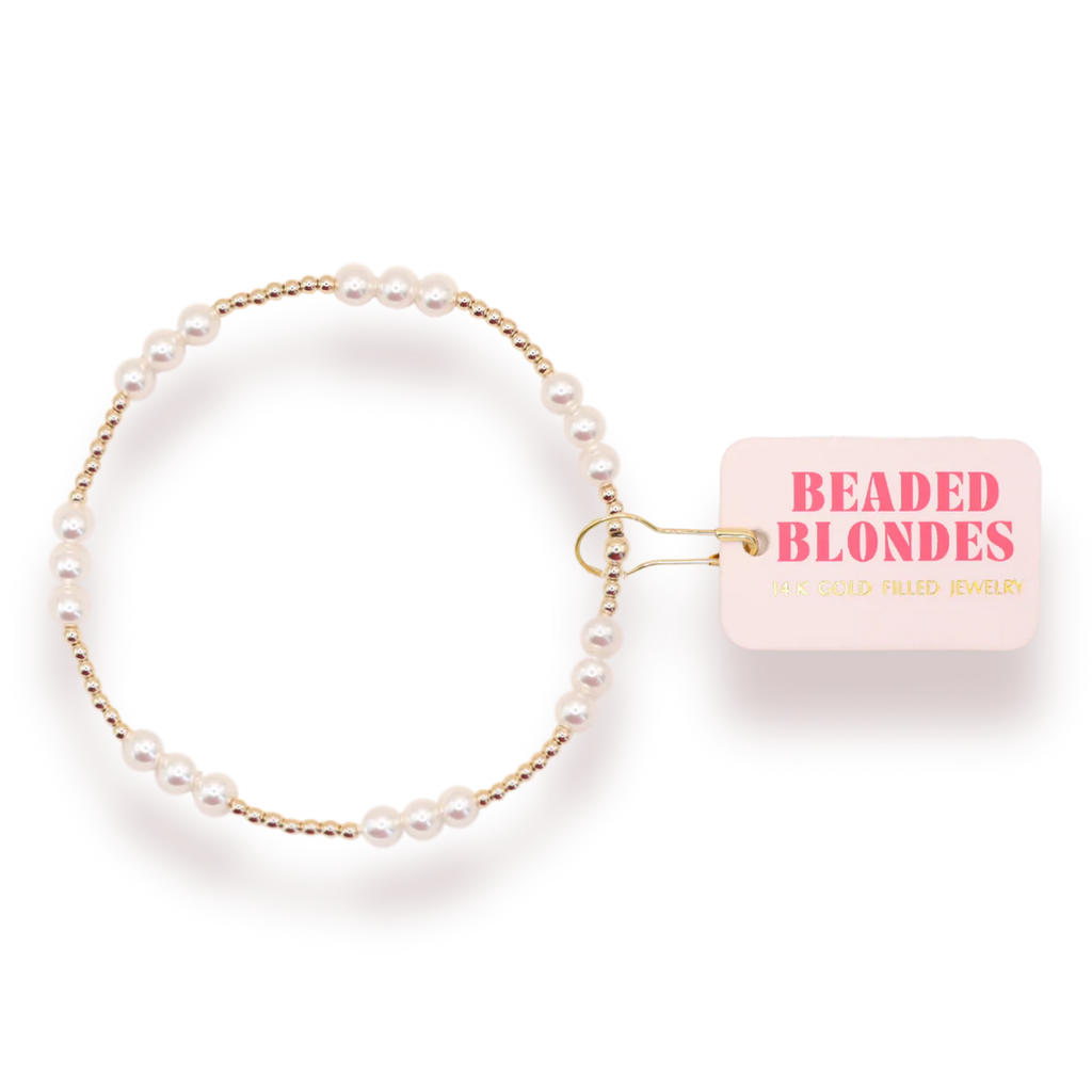 Pearl bracelet with a pink box labeled 'Beaded Blondes' on a white background