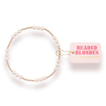 Pearl bracelet with a pink box labeled 'Beaded Blondes' on a white background