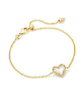 Gold bracelet with a heart-shaped charm on a white background