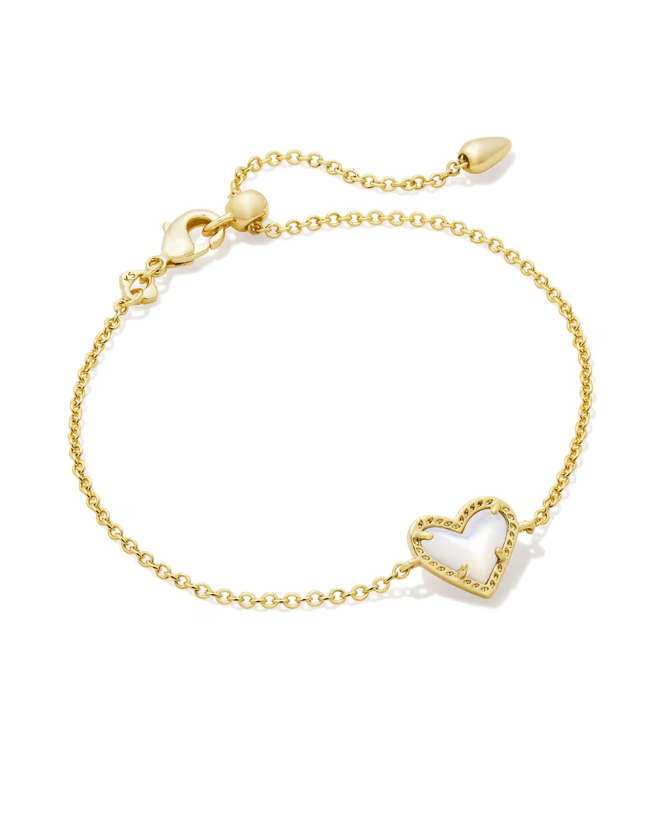 Gold bracelet with a heart-shaped charm on a white background