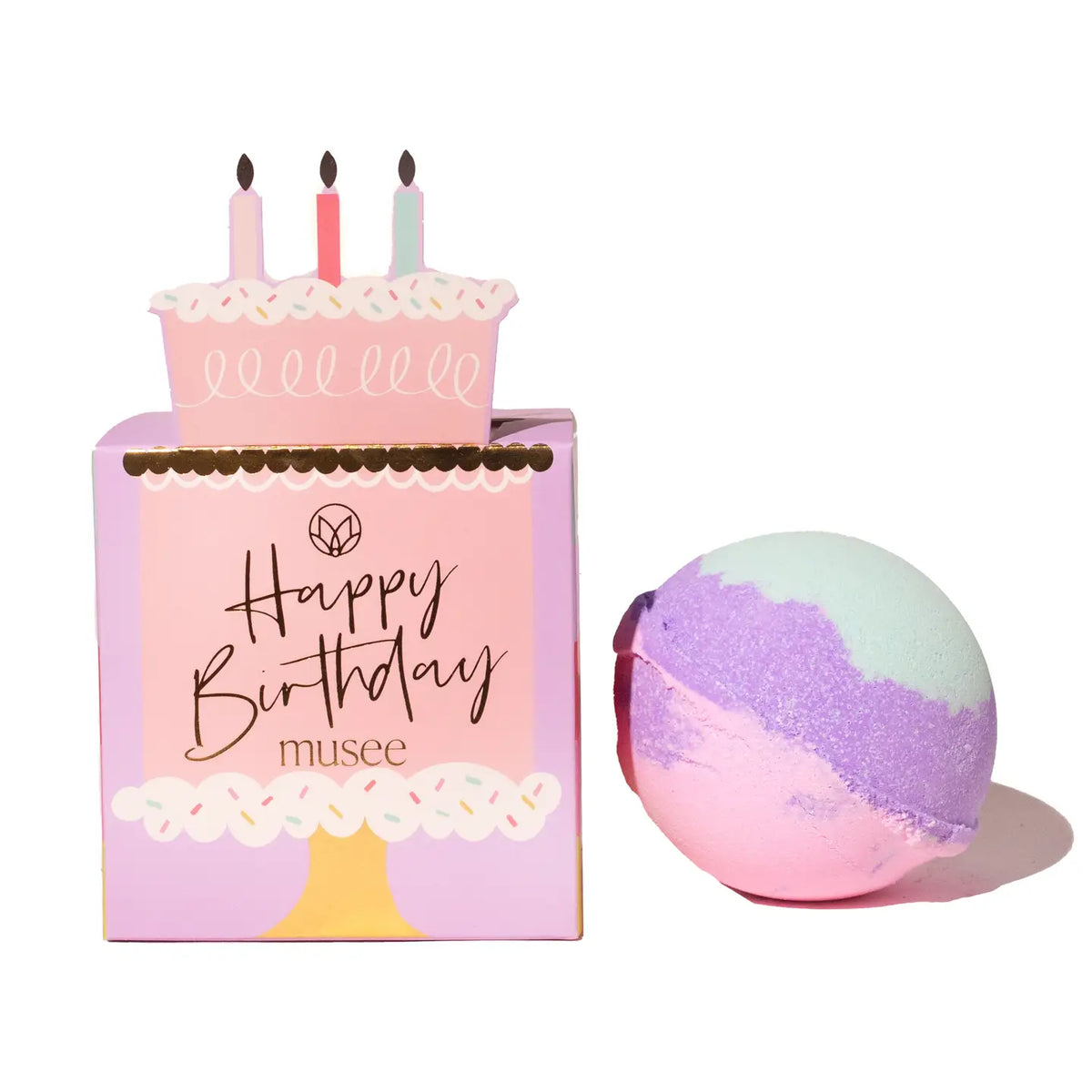 Bath bomb with a 'Happy Birthday' themed packaging on a white background