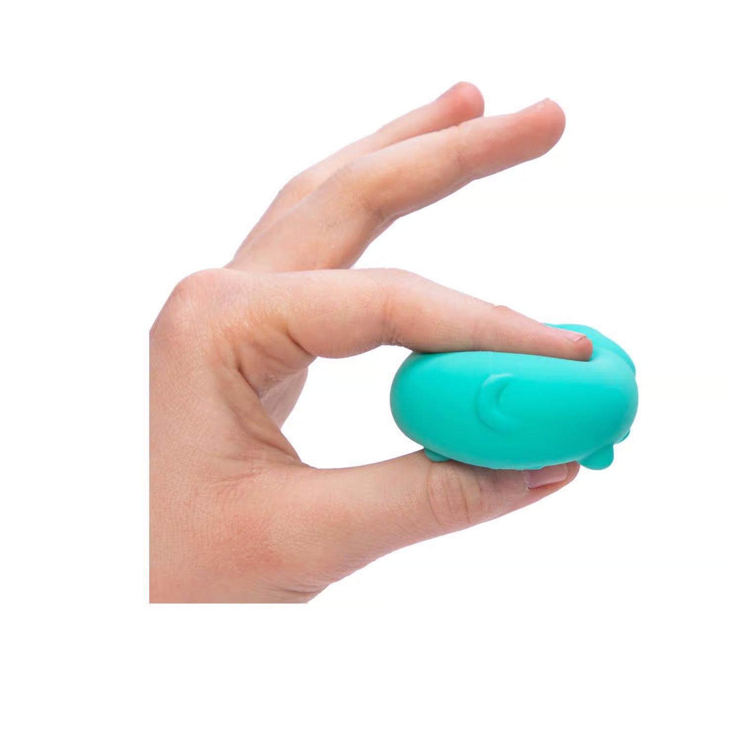 Hand holding a teal NeeDoh Teenie Funky Pups against a white background