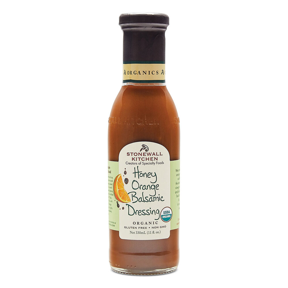 Bottle of Stonewall Kitchen Honey Orange Balsamic Dressing on a white background