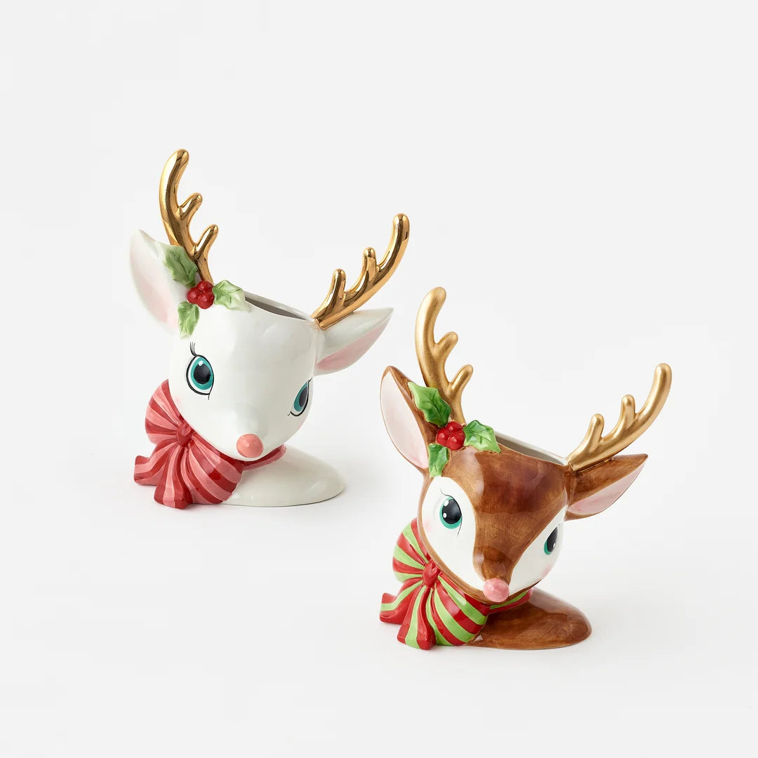 Two ceramic Christmas deer figurines with gold antlers, green holly accents, and red-and-green striped scarves, shown on a clean white background.