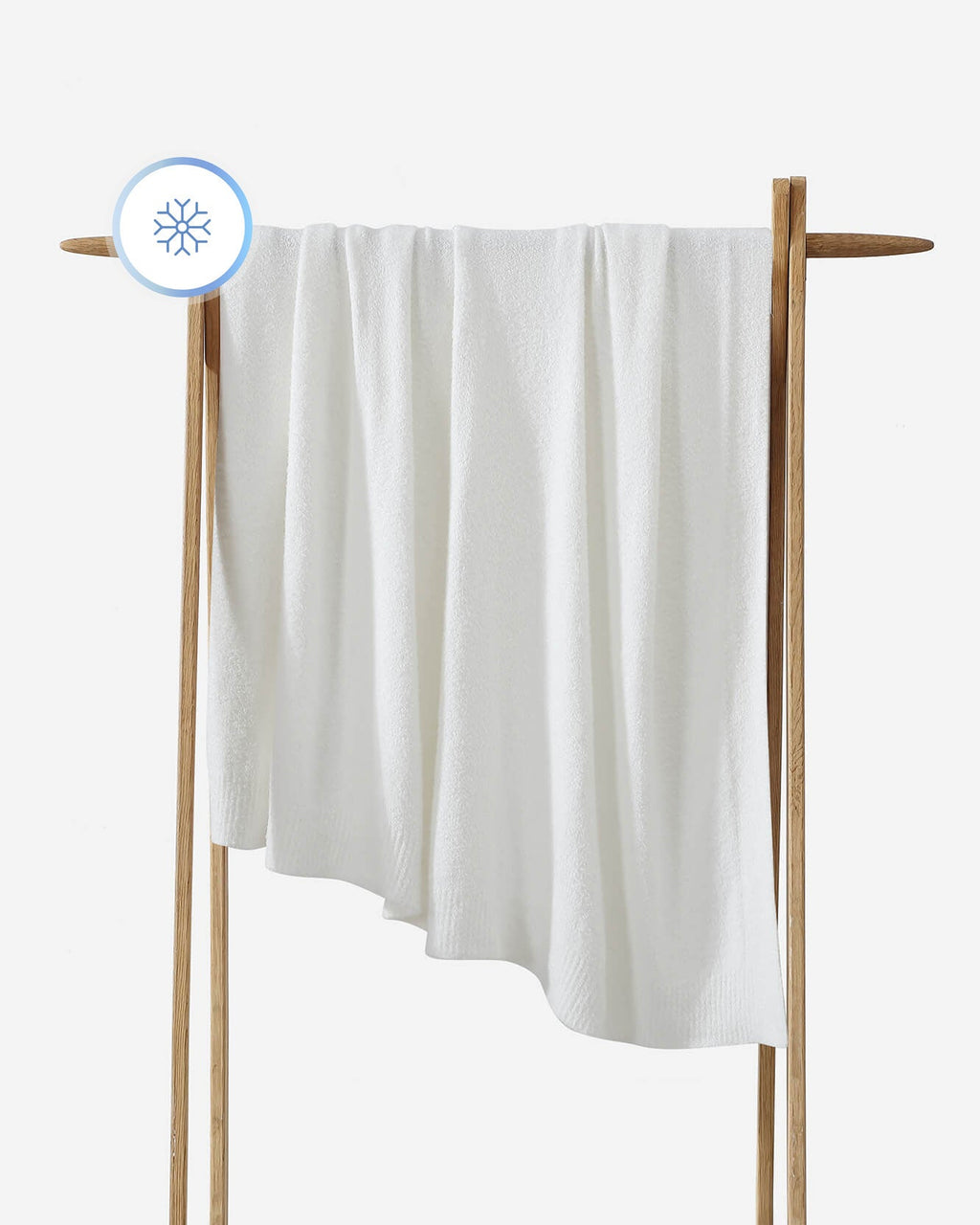 White towel on a wooden rack with a white background