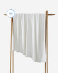 White towel on a wooden rack with a white background