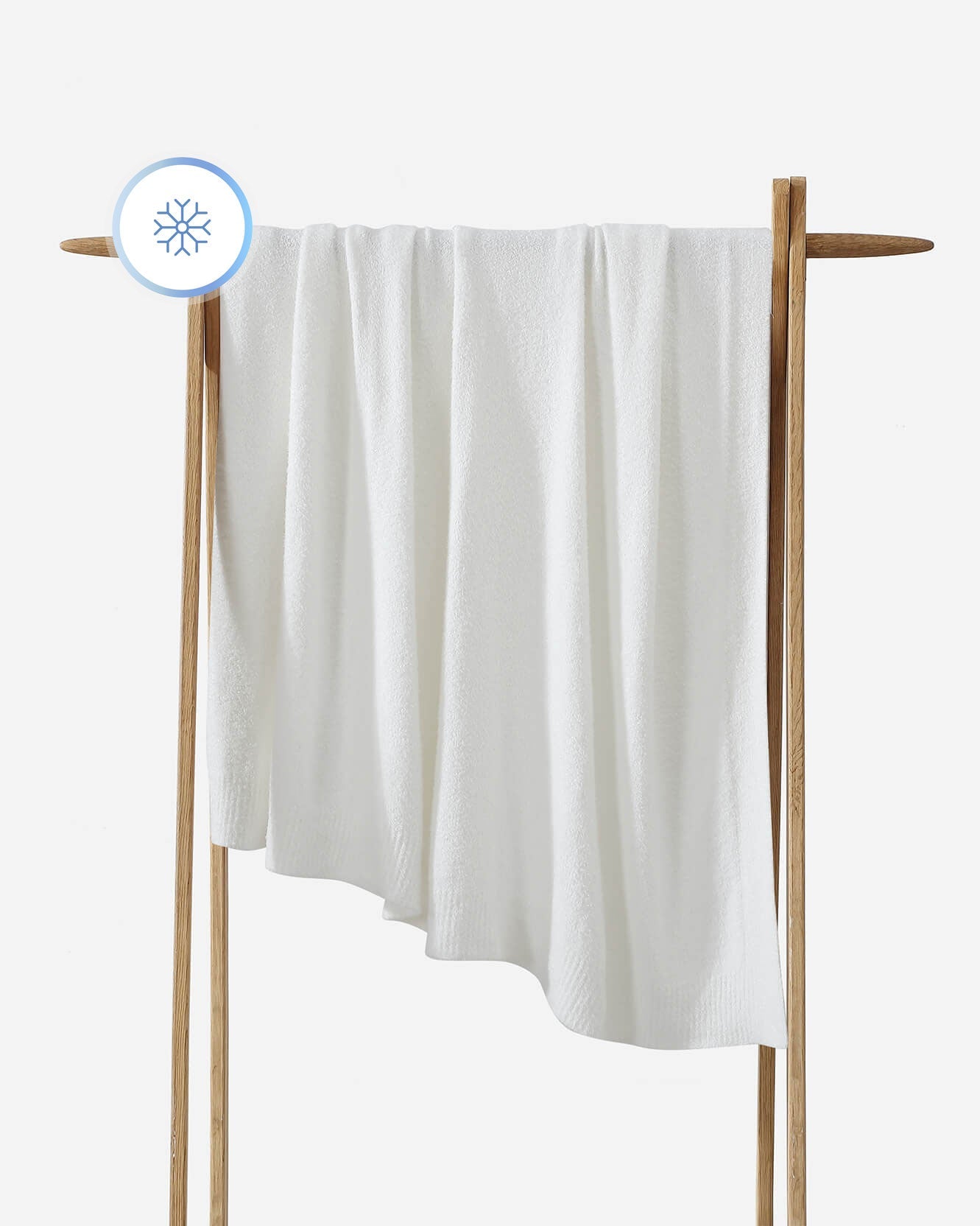 White towel on a wooden rack with a white background