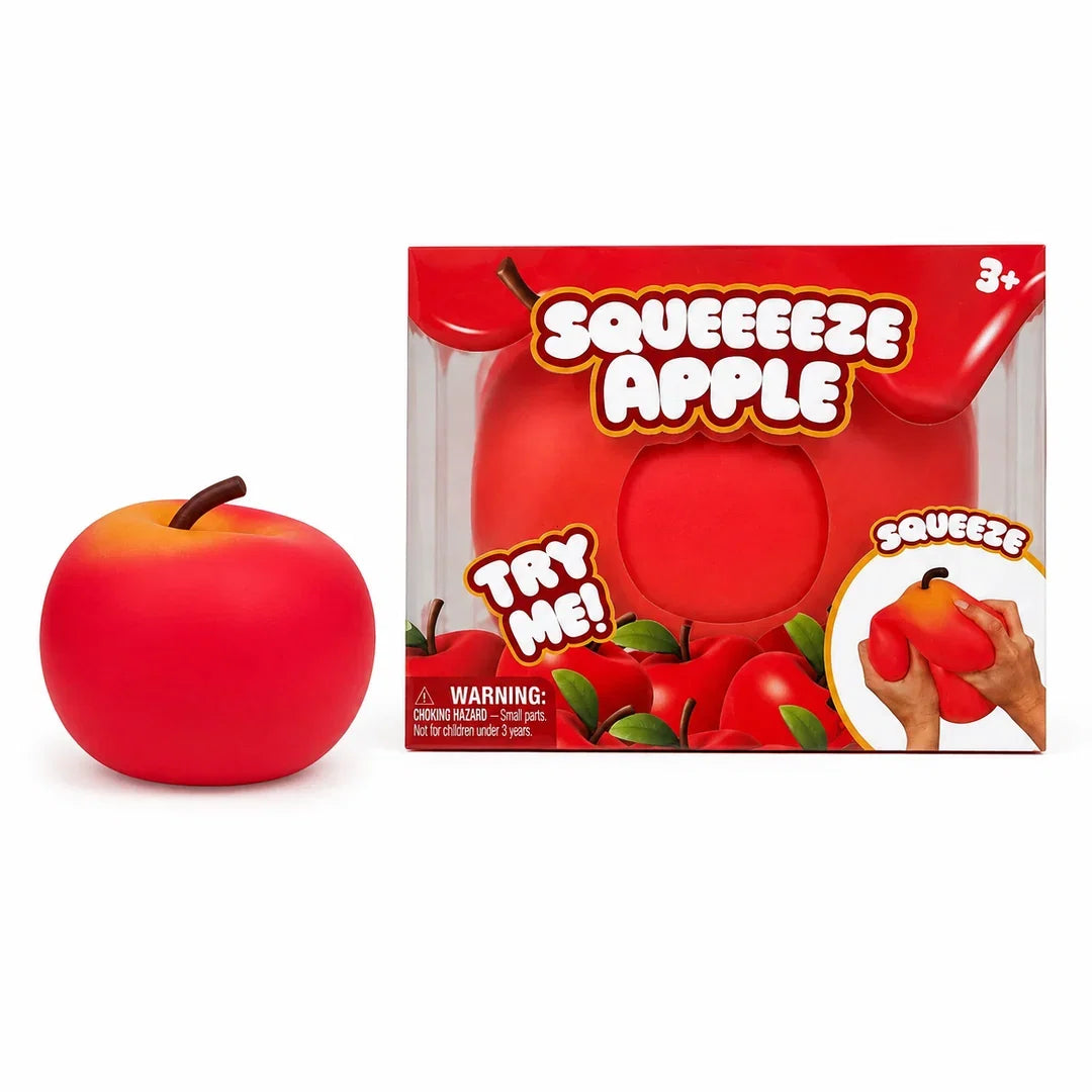 A red squishy apple toy shown next to its retail packaging box on a clean white background. The box features the text 'SQUEEEZE APPLE' and includes a demonstration graphic of a hand squeezing the apple.