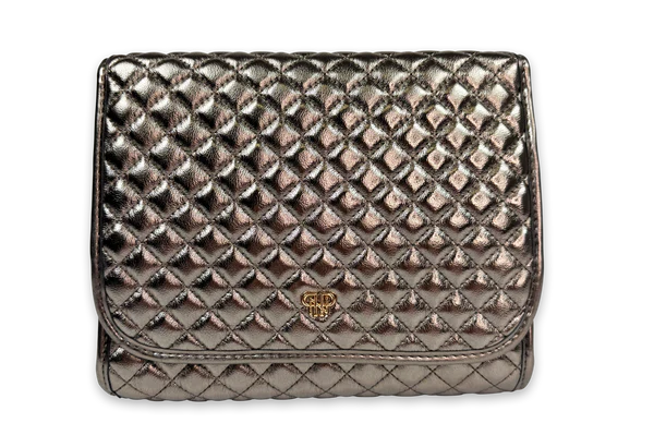 Quilted metallic handbag on a white background