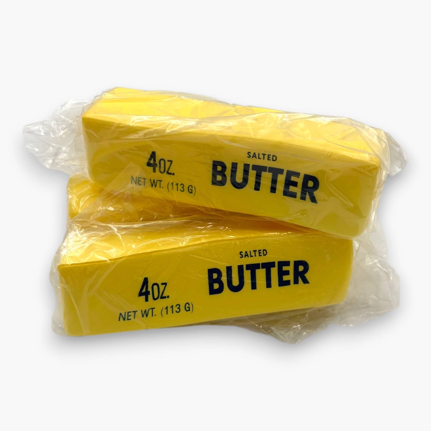 Two packages of 4oz salted butter on a white background