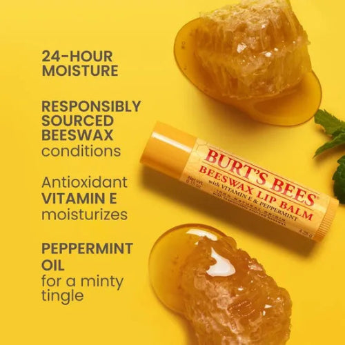 Burt's Bees beeswax lip balm on a yellow background with honeycomb and mint leaves.