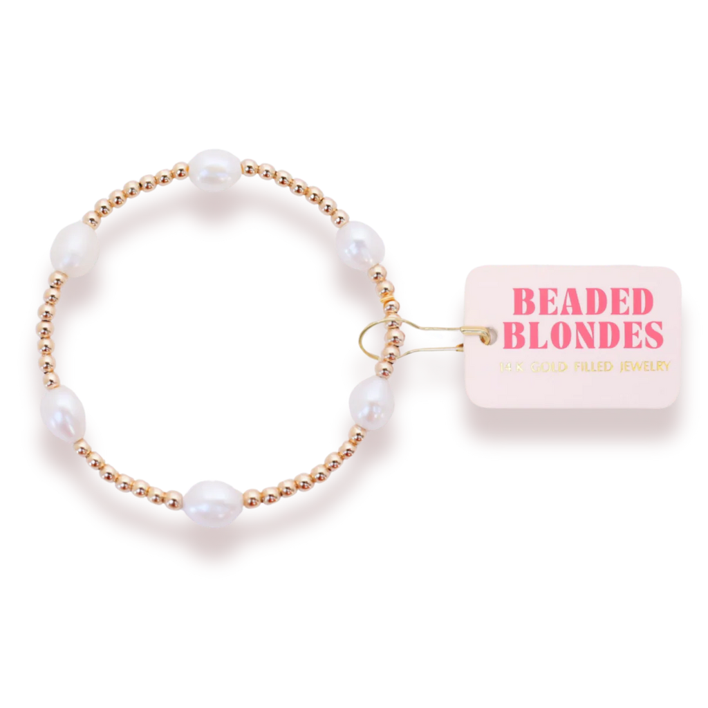 Pearl bracelet with gold accents and a 'Beaded Blondes' box on a white background