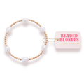 Pearl bracelet with gold accents and a 'Beaded Blondes' box on a white background