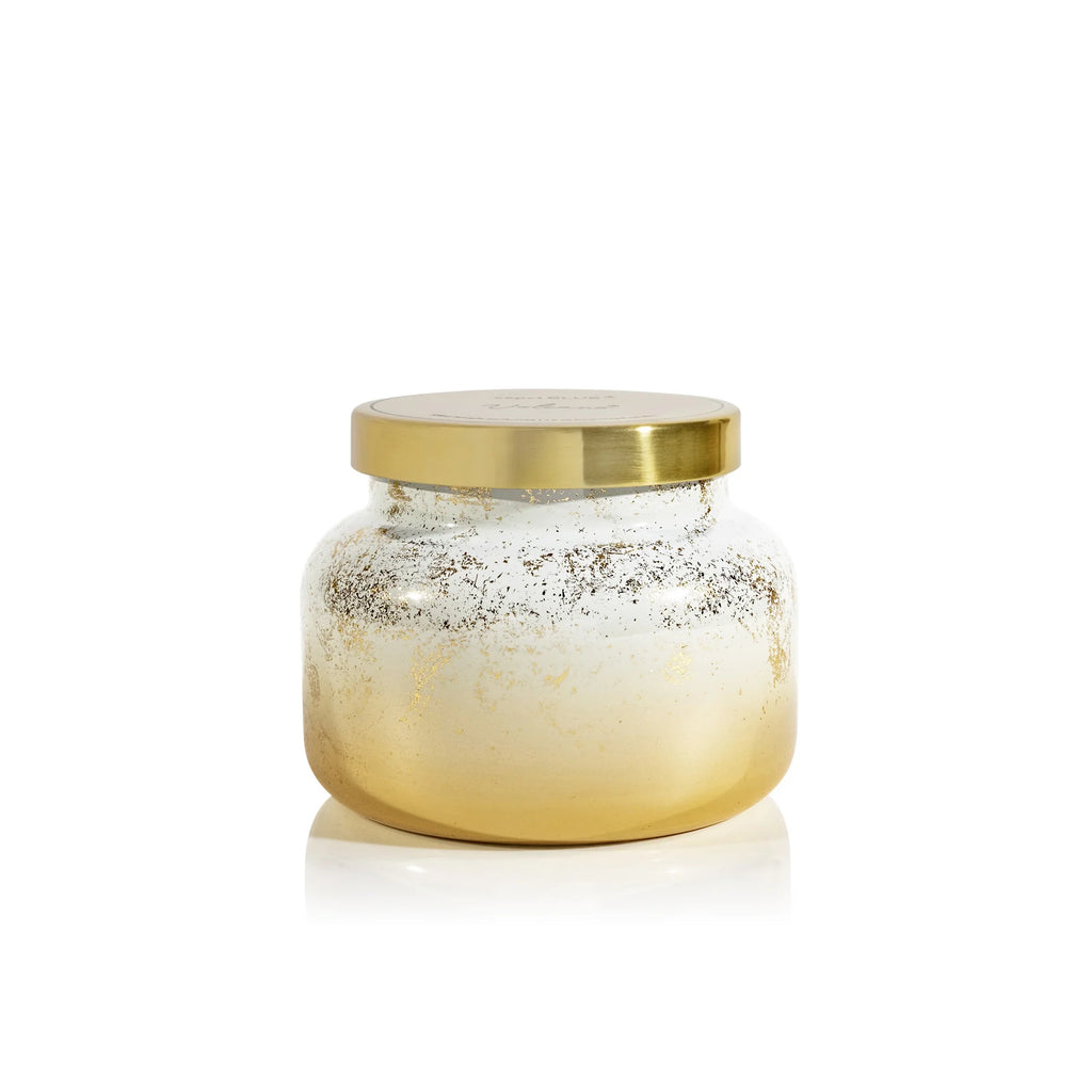 Capri Blue Volcano Glimmer signature candle in white ombré glass with gold accents and tropical citrus fragrance